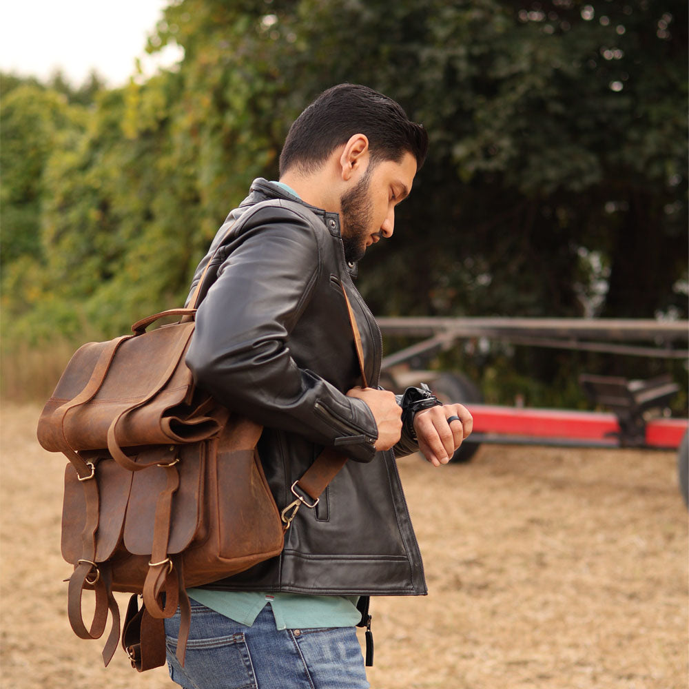 brown leather jacket man with backpack Parsons Roll Top Vintage Oiled Cowhide Backpack