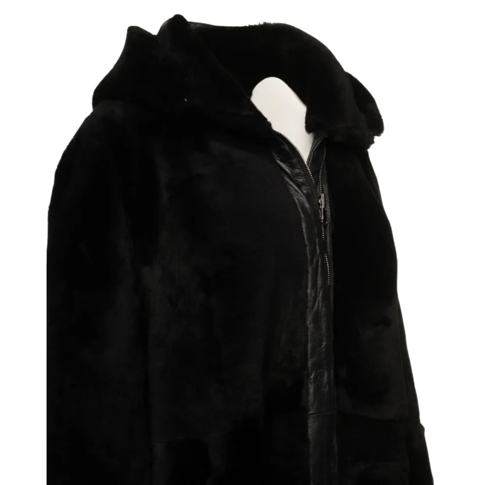 Side view of the Avalon Black oversized reversible sheepskin long coat, highlighting its sleek silhouette and reversible feature for two distinct looks.