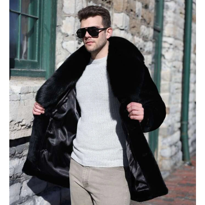 Man wearing a black fur coat and sunglasses against a stone building background