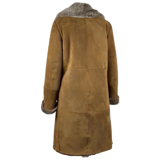 Back view of the long-line Sabina shearling coat in tobacco brown, showcasing the oversized leather silhouette and clean seam construction.