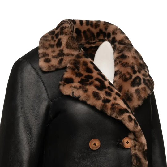 Side close up of the Seraphina leopard print coat showing the roomy sleeves and structured shoulder design.