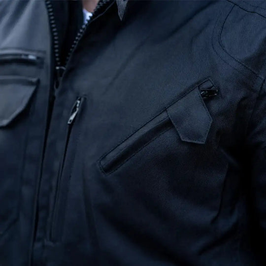 Close-up of the waterproof leather surface and water-resistant zippers with protective fabric welts to prevent leaks.