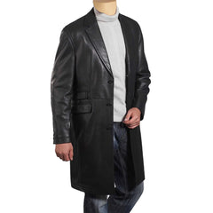 Front view of a black leather 3/4 length trench coat on a mannequin, featuring a button-down front and classic collar.