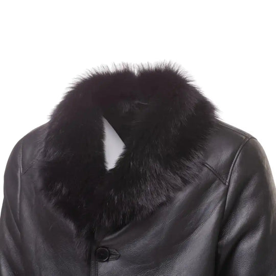Close-up of the long-haired Toscana fur collar on the black shearling trench coat, showcasing the silky texture.
