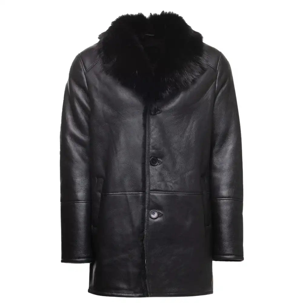 Front view of a black shearling trench coat featuring a dramatic Toscana fur collar and belted waist.