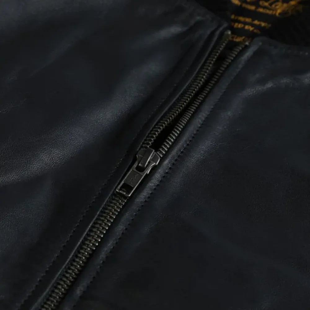 Black Bomber Style Ribbed Jacket close up of front zipper on black leather bomber jacket