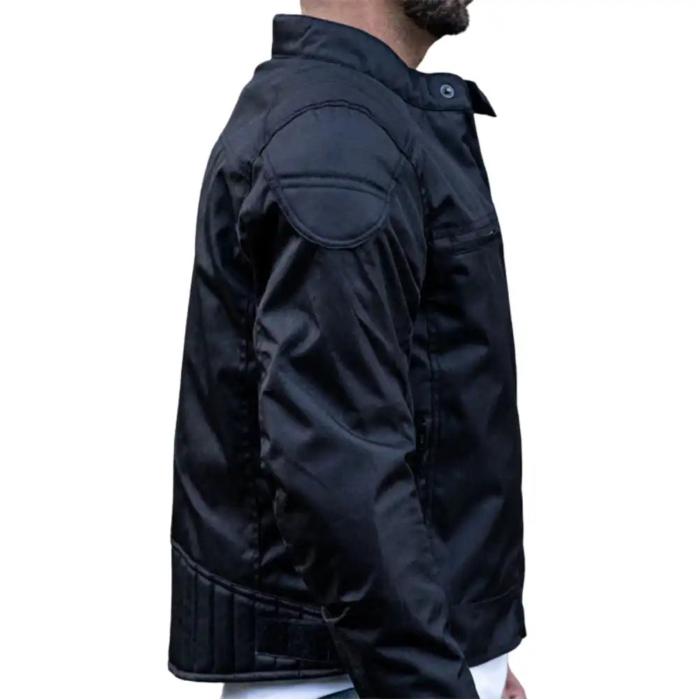 Side view of a technical leather motorcycle jacket featuring a waterproof matte finish, integrated chest vents, and a high-neck storm closure.