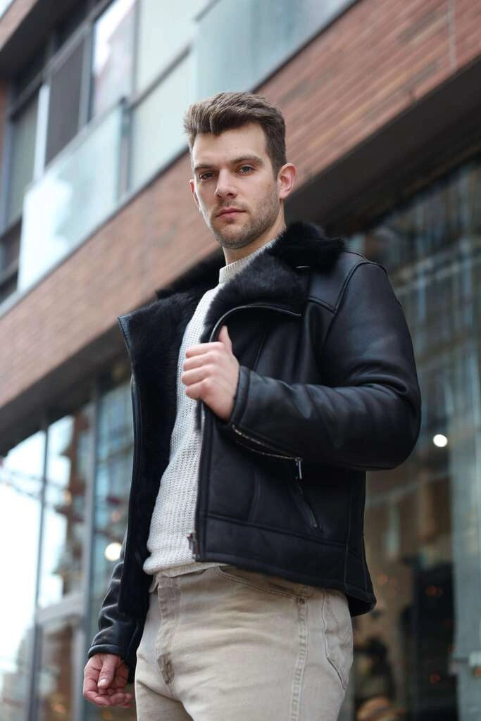 Man wearing a Carter's Toscana Shearling Leather Biker Jacket with fur trim in an urban setting