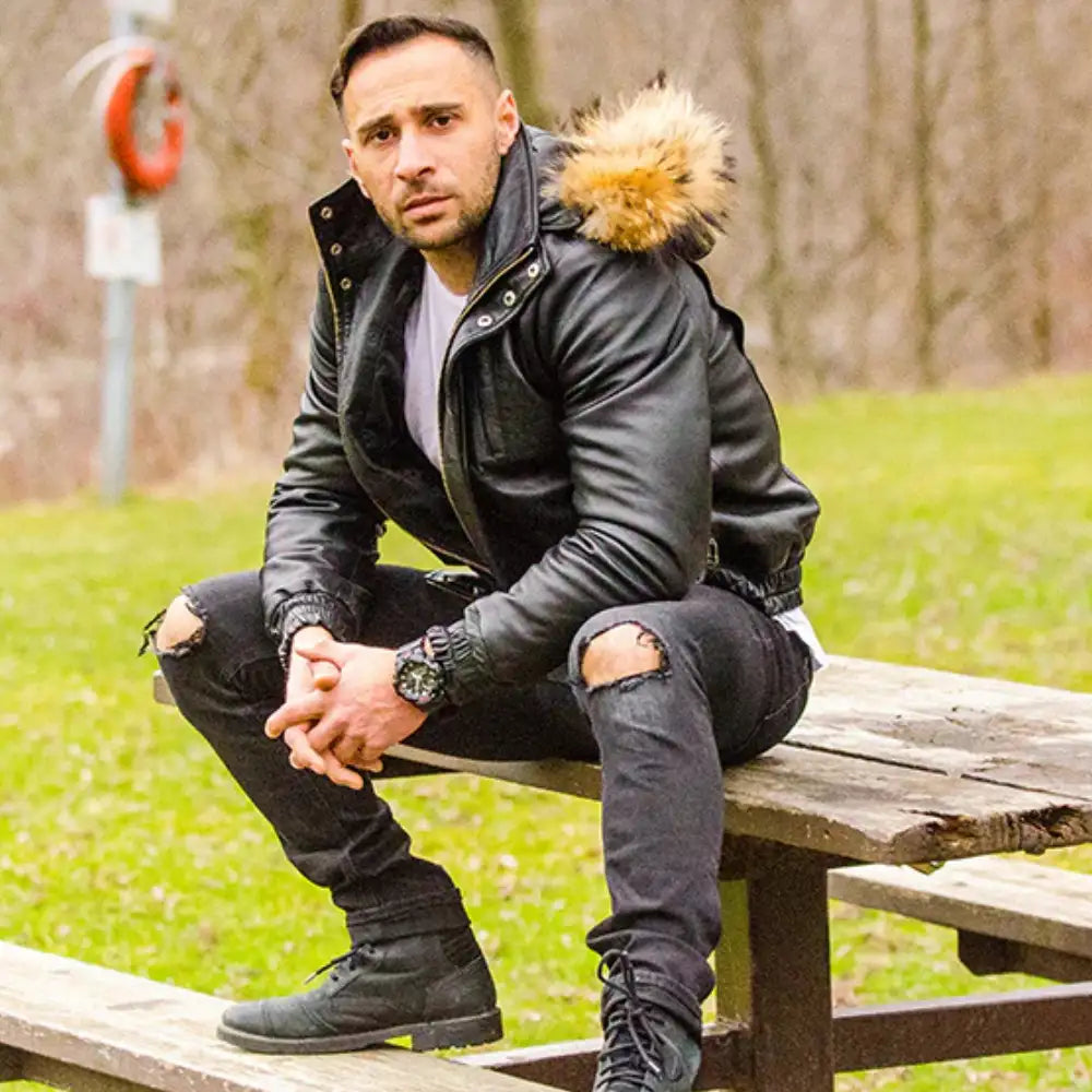 Side profile model wearing Castillos Bomber Winter Leather Jacket with Real Fox Fur Hoodie