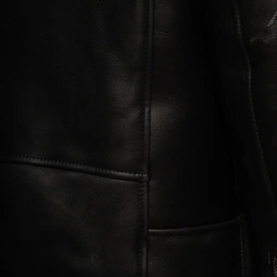 Closeup of zipper and buckle detail on Cater's Toscana Shearling Leather Biker Jacket