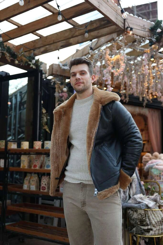 Man wearing Classic Ginger Brown B3 Bomber Aviator Shearling Jacket, standing in an outdoor market setting.