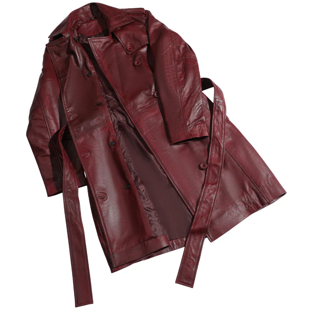 Detailed full macro shot of the premium coral red leather grain, showcasing the rich color and soft, smooth finish.