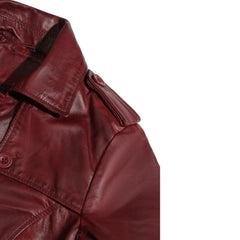 Close-up of a red leather jacket shoulder on a white background