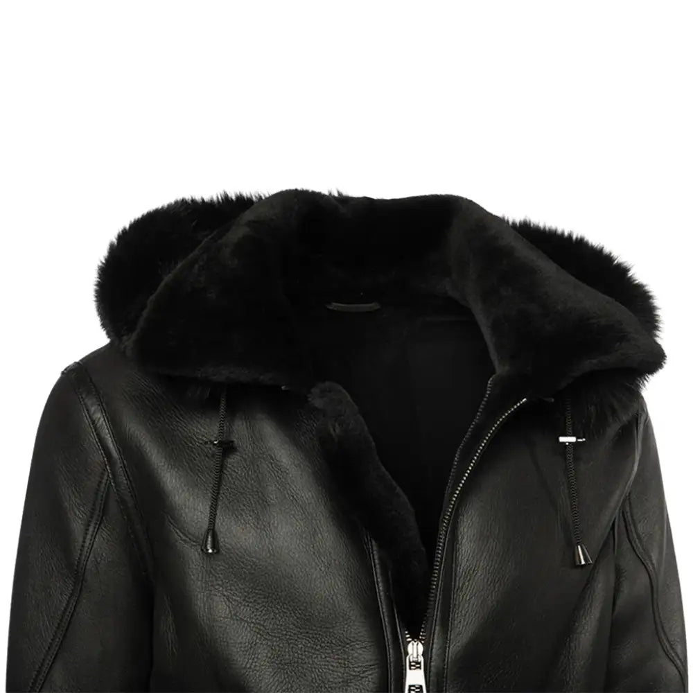 Close-up view of a black bomber shearling jacket with a soft, fuzzy hood, showcasing the premium leather exterior and adjustable hood drawstrings.