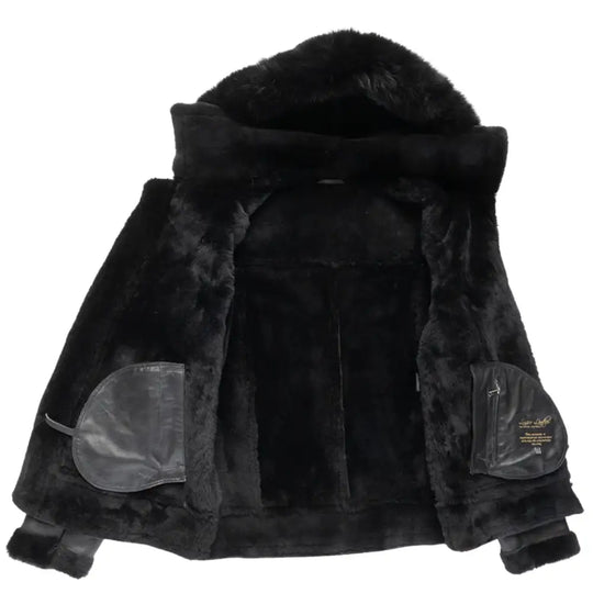 Interior of the black bomber shearling jacket showing the full shearling lining for added warmth and comfort, designed with functionality and style.
