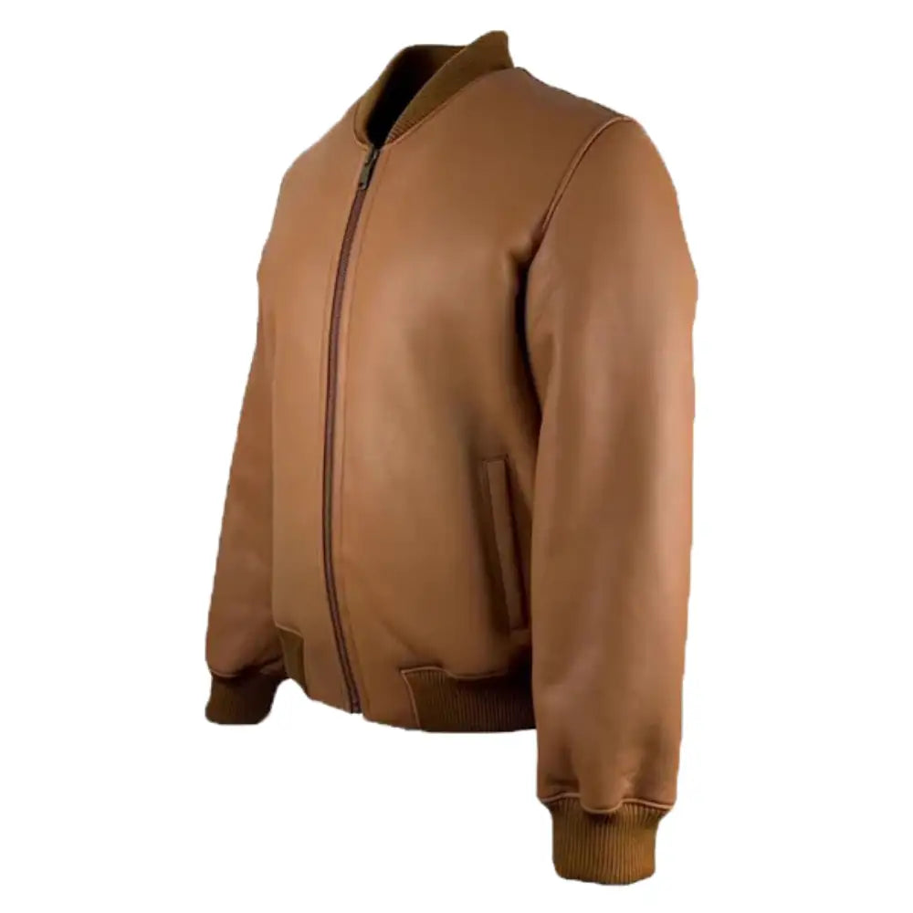 Another side view of the Jonathan Tan shearling bomber jacket, displaying the leather texture, ribbed waistband, and zipper.