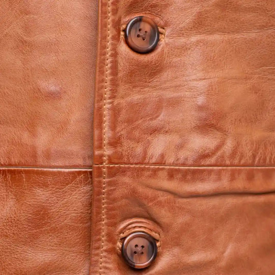 Logan English Tan Leather Trench Coat close up button closure on leather trench coat