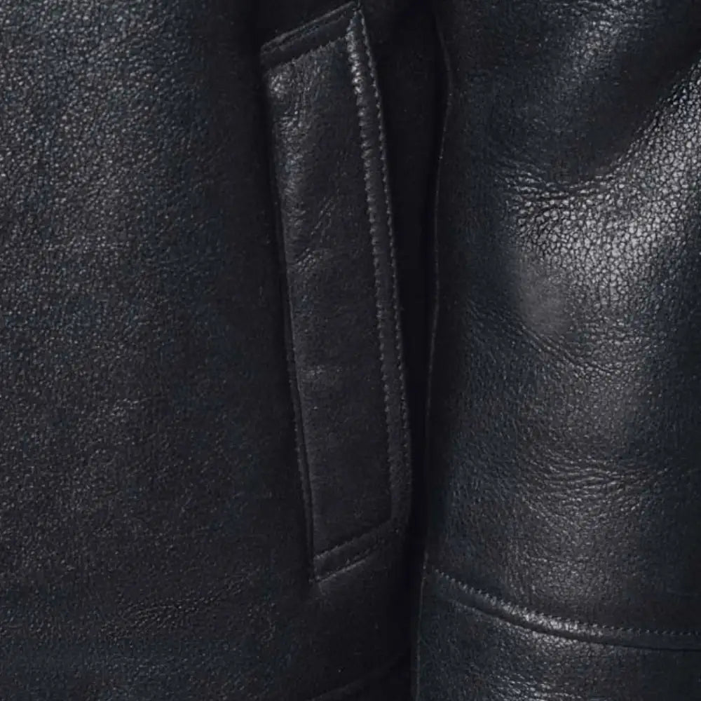 Detailed view of the pockets on the Lucas Black Aviator Bomber Shearling Jacket with Hoodie, designed for convenience and added style.
