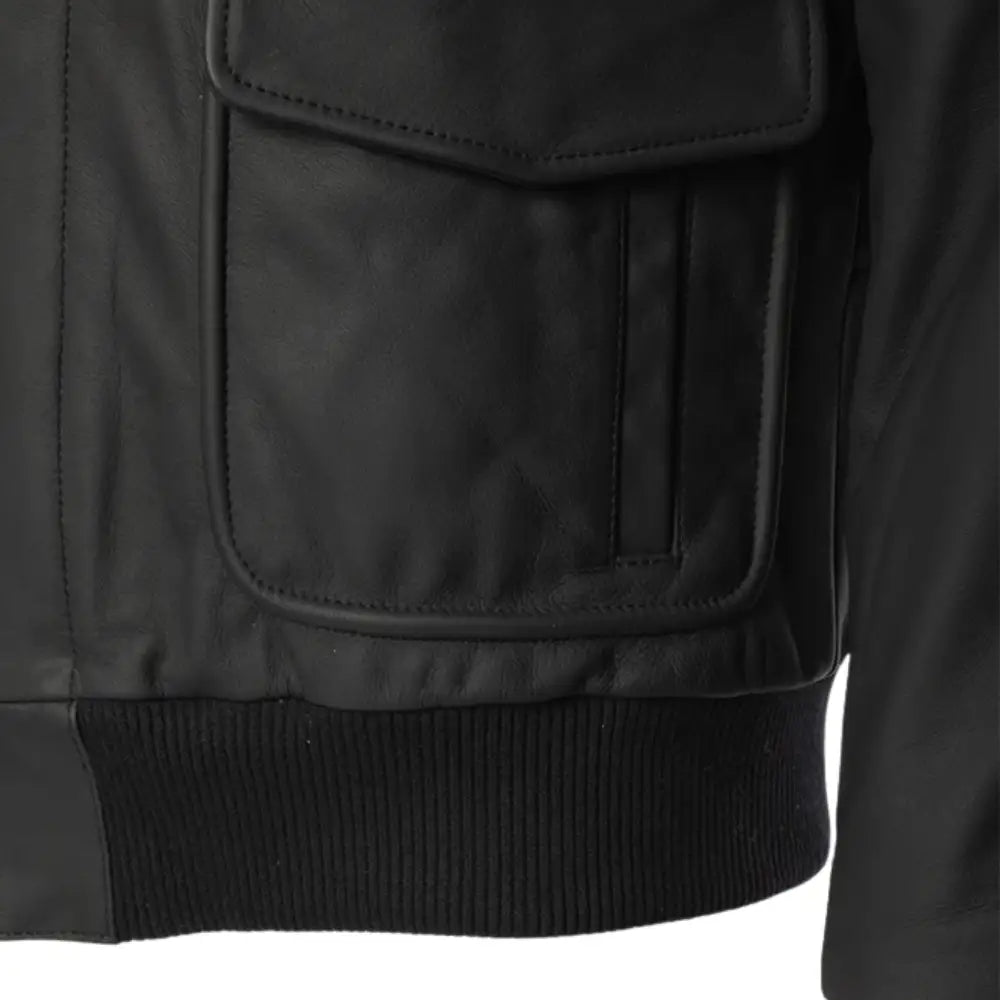 Close-up of the dual flap pockets on the matte black A2 bomber leather jacket.