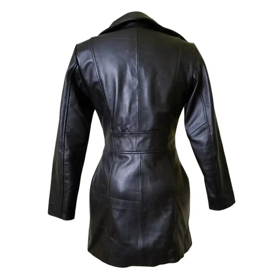 Rear view of Nelly's long leather coat highlighting the clean longline silhouette and center back vent for mobility.