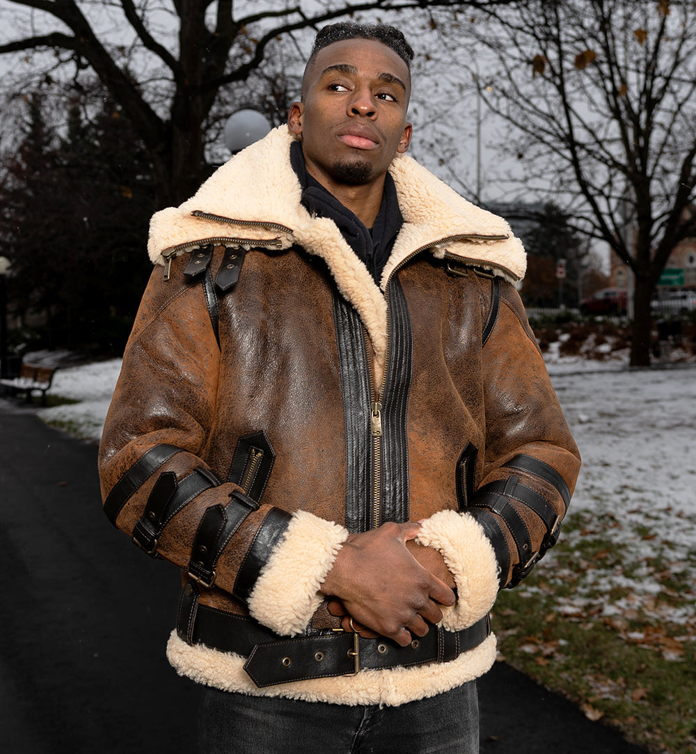 Model wearing Richard's Vintage Distressed Brown Aviator Bomber Shearling Jacket outdoors, showcasing the bold distressed leather design with shearling lining and adjustable straps.