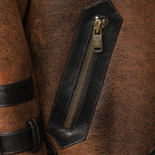 Close-up of the stylish pocket detail and distressed leather material on Richard's Vintage Distressed Brown Aviator Bomber Shearling Jacket with adjustable strap accents.