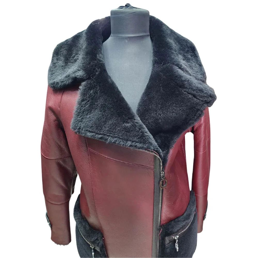 A close-up of the upper portion of the trench coat, focusing on the wide notched black shearling collar and the asymmetrical neckline zipper.