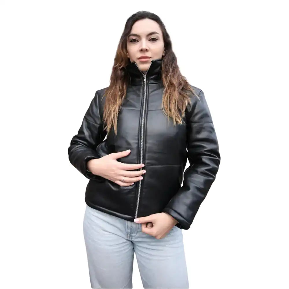 A model wearing the Sorine black leather puffer jacket styled with a turtleneck, showcasing its chic, lightweight yet insulated look.