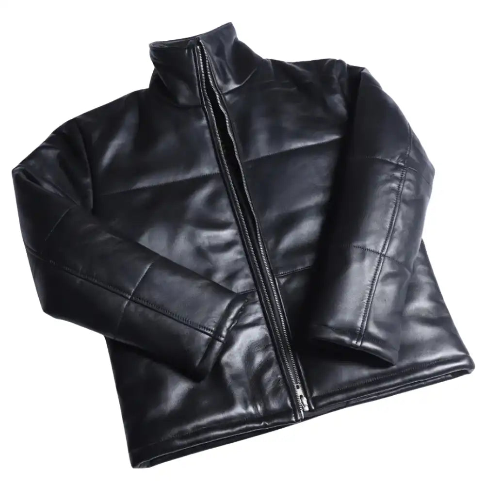 View of the Sorine women’s black leather puffer jacket, featuring a slim-fit quilted design and a high stand-up collar.