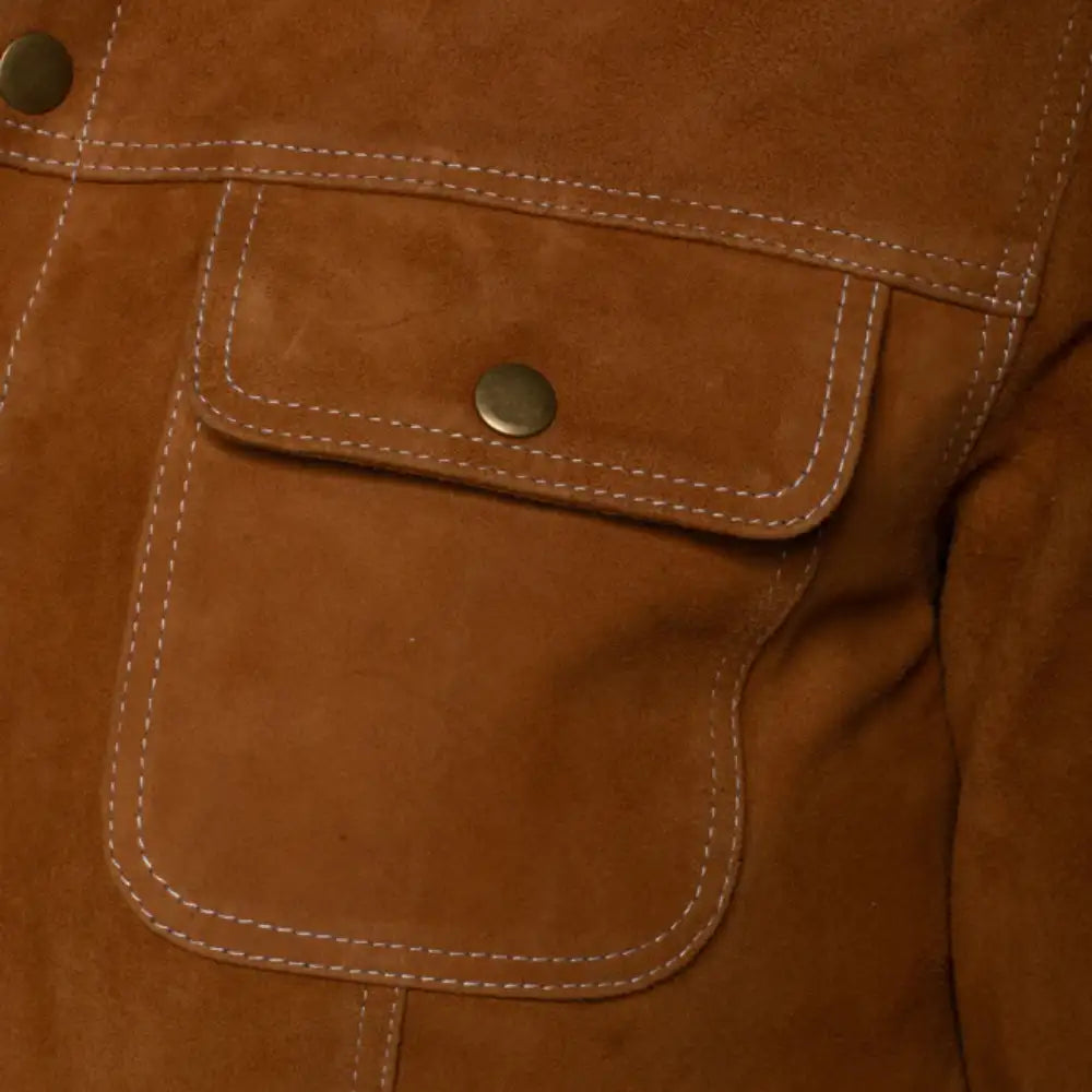 Close-up of a tan suede leather jacket with buttoned pocket