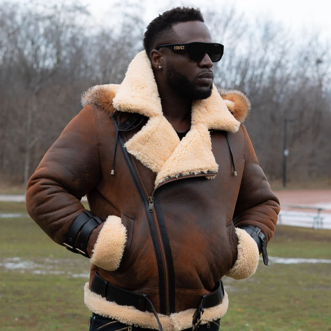 Lifestyle photoshoot of a man wearing Rocco vintage brown aviator shearling jacket featuring a classic cream shearling collar in an outdoor setting.