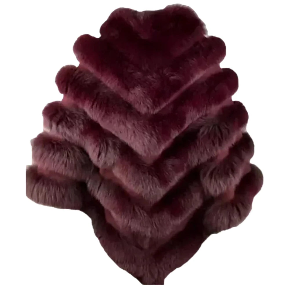 The back view of a burgundy fox fur poncho for women, showcasing the seamless flow of the fur across the shoulders and the mid-length hemline.