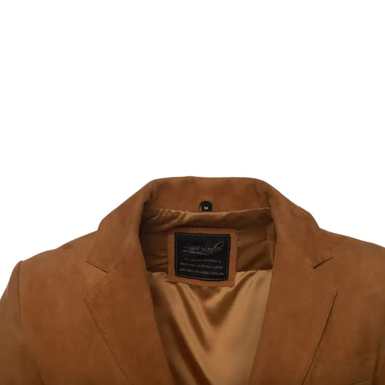Detailed view of collar of Wyatt tan suede leather blazer on a white background showcasing Lusso leather brand label